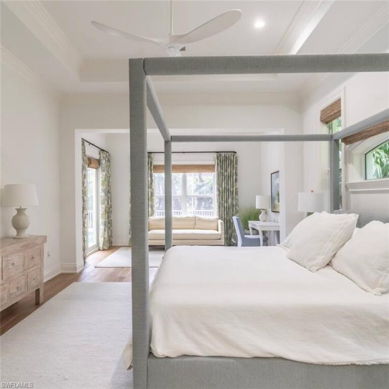 428 Rudder Road Naples, FL 34102 - Photo 9 of 47 Bedroom with wood finished floors, a ceiling fan, and crown molding