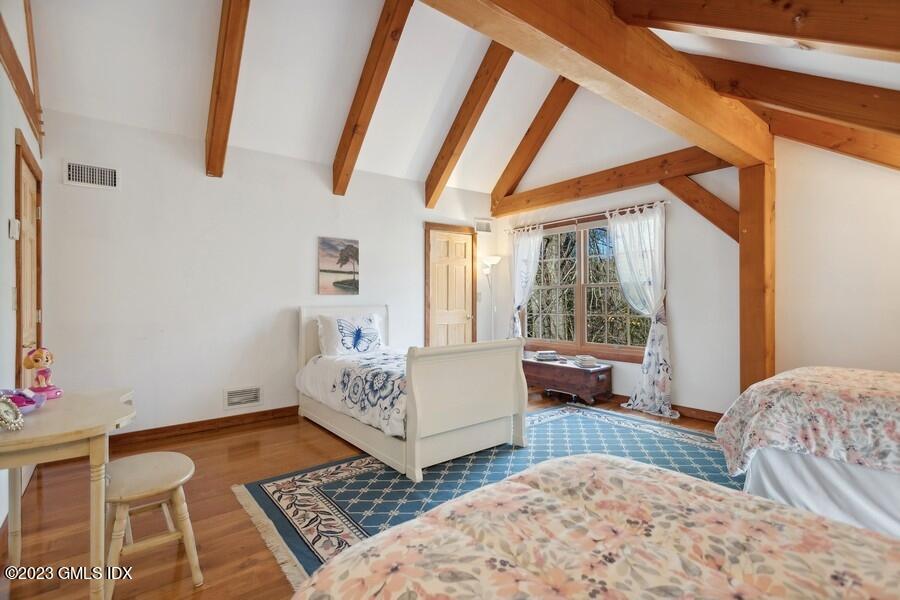 96 Cat Rock Road Cos Cob, CT 06807 - Photo 21 of 38 a bedroom with furniture and a window
