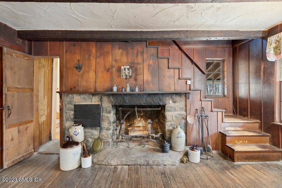 96 Cat Rock Road Cos Cob, CT 06807 - Photo 23 of 38 a living room with furniture and a fireplace