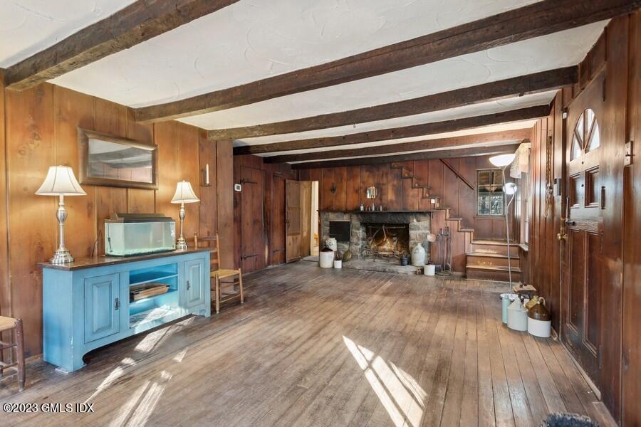 96 Cat Rock Road Cos Cob, CT 06807 - Photo 24 of 38 a view of a livingroom with furniture and a fireplace