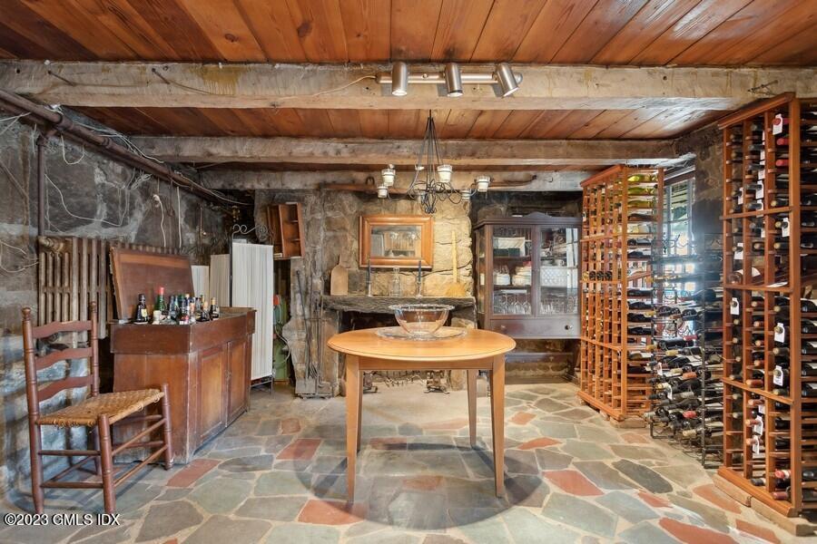 96 Cat Rock Road Cos Cob, CT 06807 - Photo 27 of 38 a patio with a table and chairs