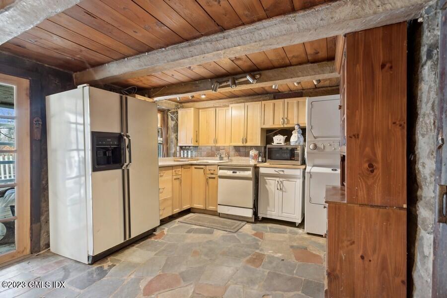 96 Cat Rock Road Cos Cob, CT 06807 - Photo 28 of 38 a kitchen with white cabinets and white appliances