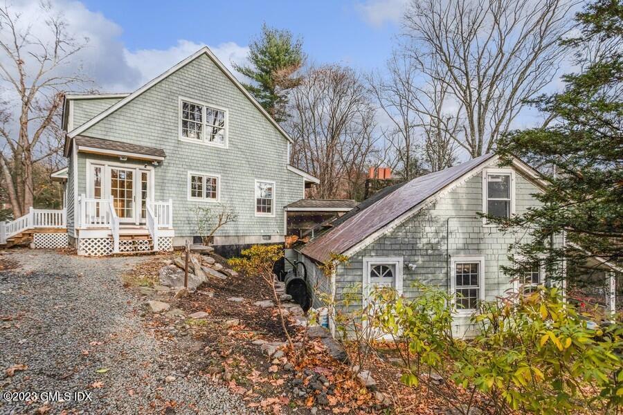 96 Cat Rock Road Cos Cob, CT 06807 - Photo 32 of 38 a view of a house with a yard