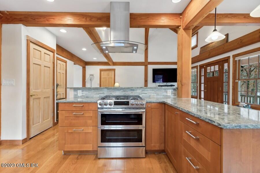 96 Cat Rock Road Cos Cob, CT 06807 - Photo 4 of 38 a kitchen with stainless steel appliances granite countertop a stove and a sink
