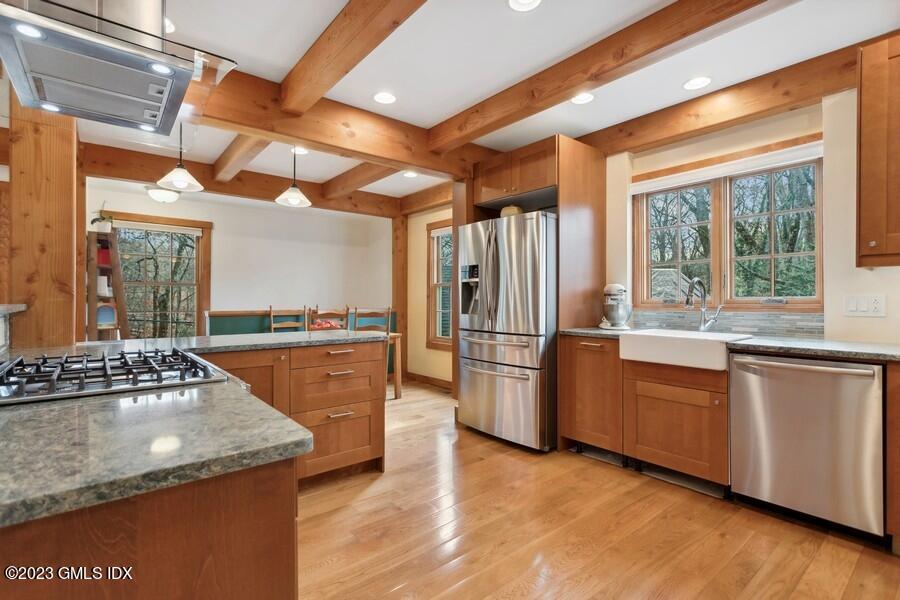 96 Cat Rock Road Cos Cob, CT 06807 - Photo 6 of 38 a kitchen with stainless steel appliances granite countertop a stove a sink and a refrigerator
