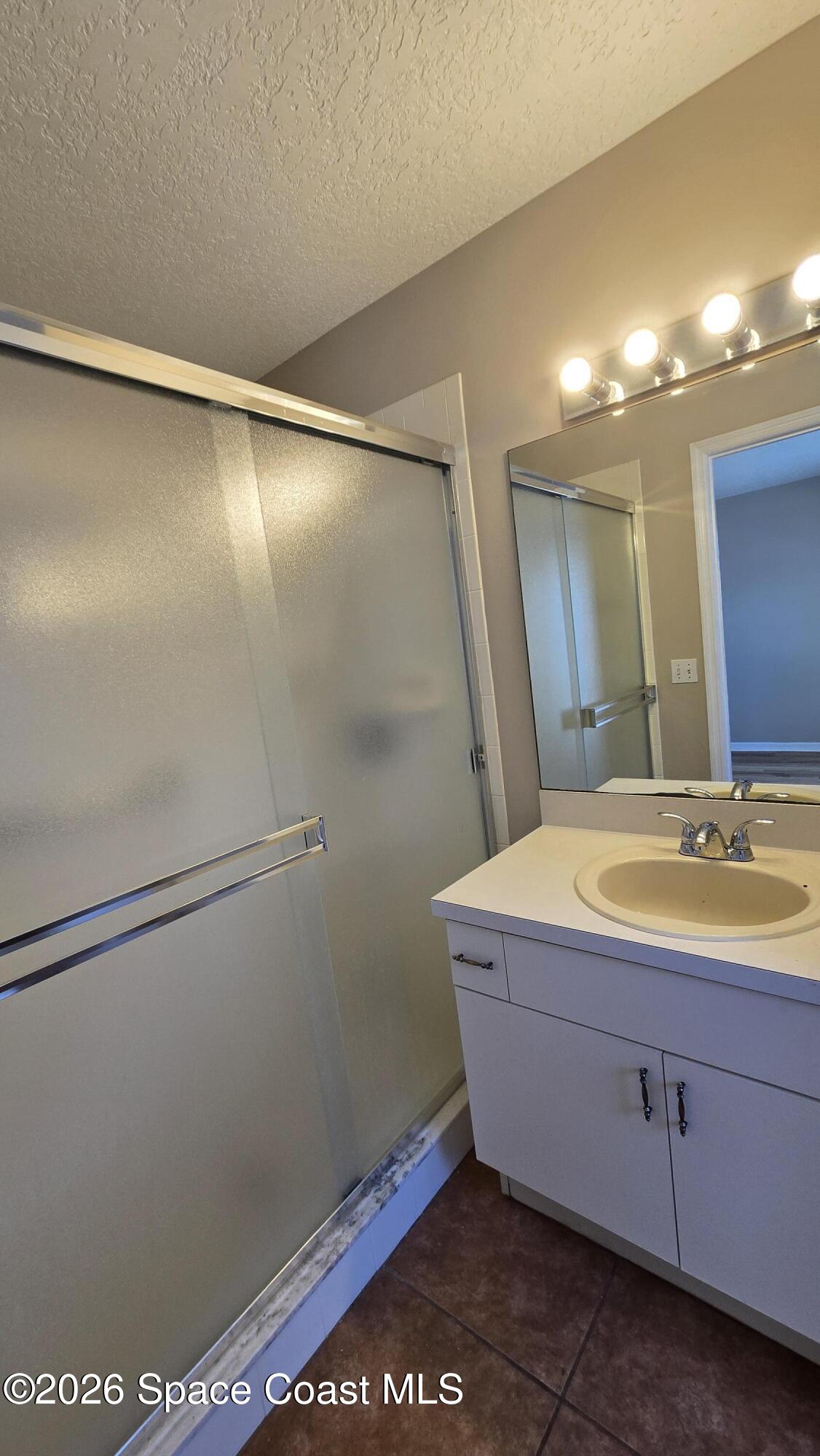 1977 Myrtle Court Palm Bay, FL 32905 - Photo 17 of 19 a bathroom with a tub and a sink