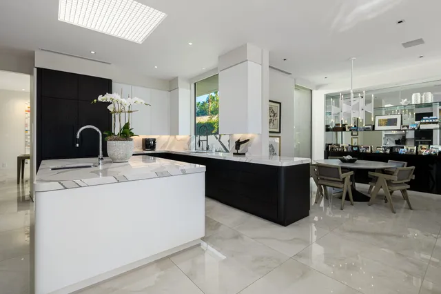 a bathroom with a double vanity sink a mirror and a shower