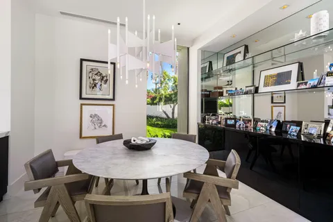 a bedroom with a large bed couch and a window