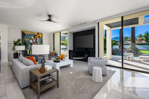 a bathroom with a tub sink and mirror