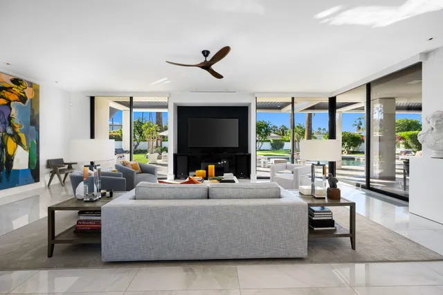 a spacious bedroom with a bed and a couch