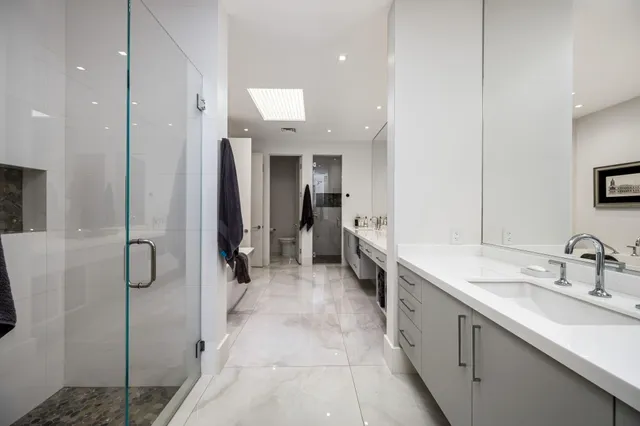 a front view of houses with yard