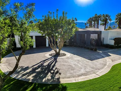 front view of a house and a potted plant