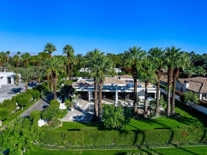 a kitchen with a table and chairs