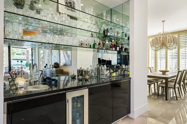 a large kitchen with kitchen island granite countertop a large counter top and stainless steel appliances