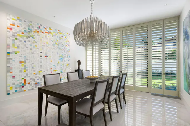 a view of a dining room with furniture and window