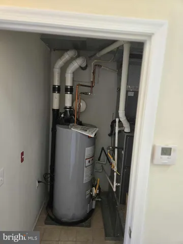 a view of storage and utility room with a sink
