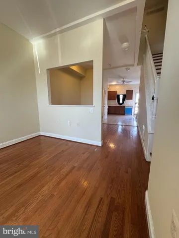 a view of a livingroom with wooden floor