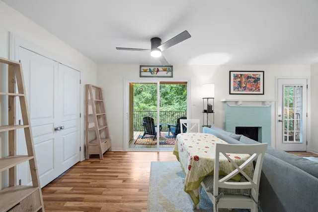 a view of a livingroom with furniture window and wooden floor