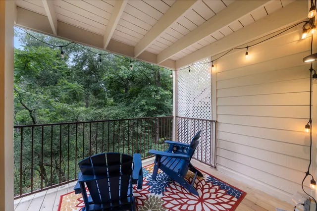 a view of a balcony with furniture