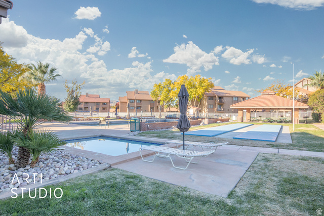 860 South Village Road, Unit A6 St. George, UT 84770 - Photo 19 of 41 View of swimming pool with patio surround, a residential view, and a gazebo