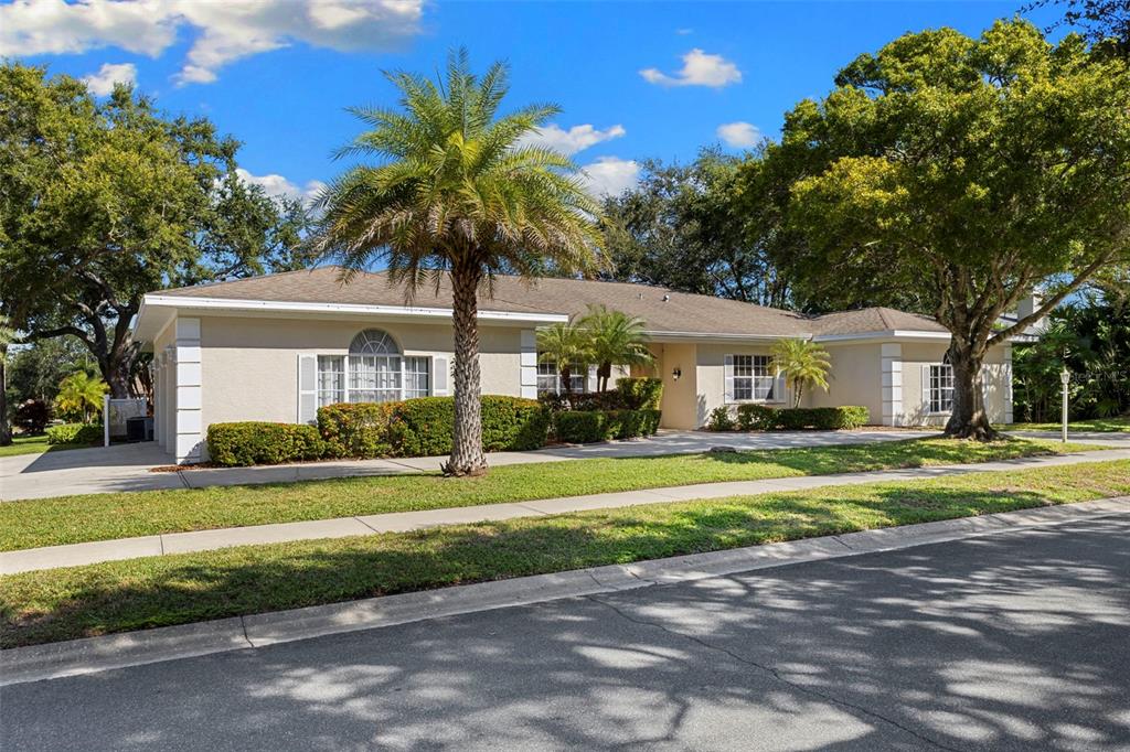 642 Weathersfield Drive Dunedin, FL 34698 - Photo 1 of 1 a front view of a house with a yard