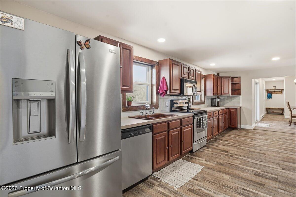 6105 State Rte 2012 Union Dale, PA 18470 - Photo 13 of 79 a kitchen with stainless steel appliances granite countertop a refrigerator and a stove top oven