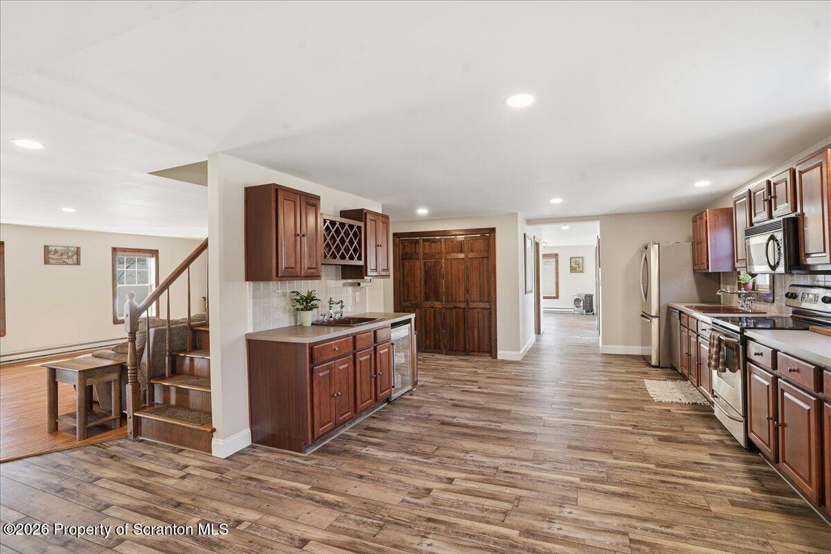 6105 State Rte 2012 Union Dale, PA 18470 - Photo 14 of 79 a large kitchen with stainless steel appliances kitchen island granite countertop a large counter top and cabinets
