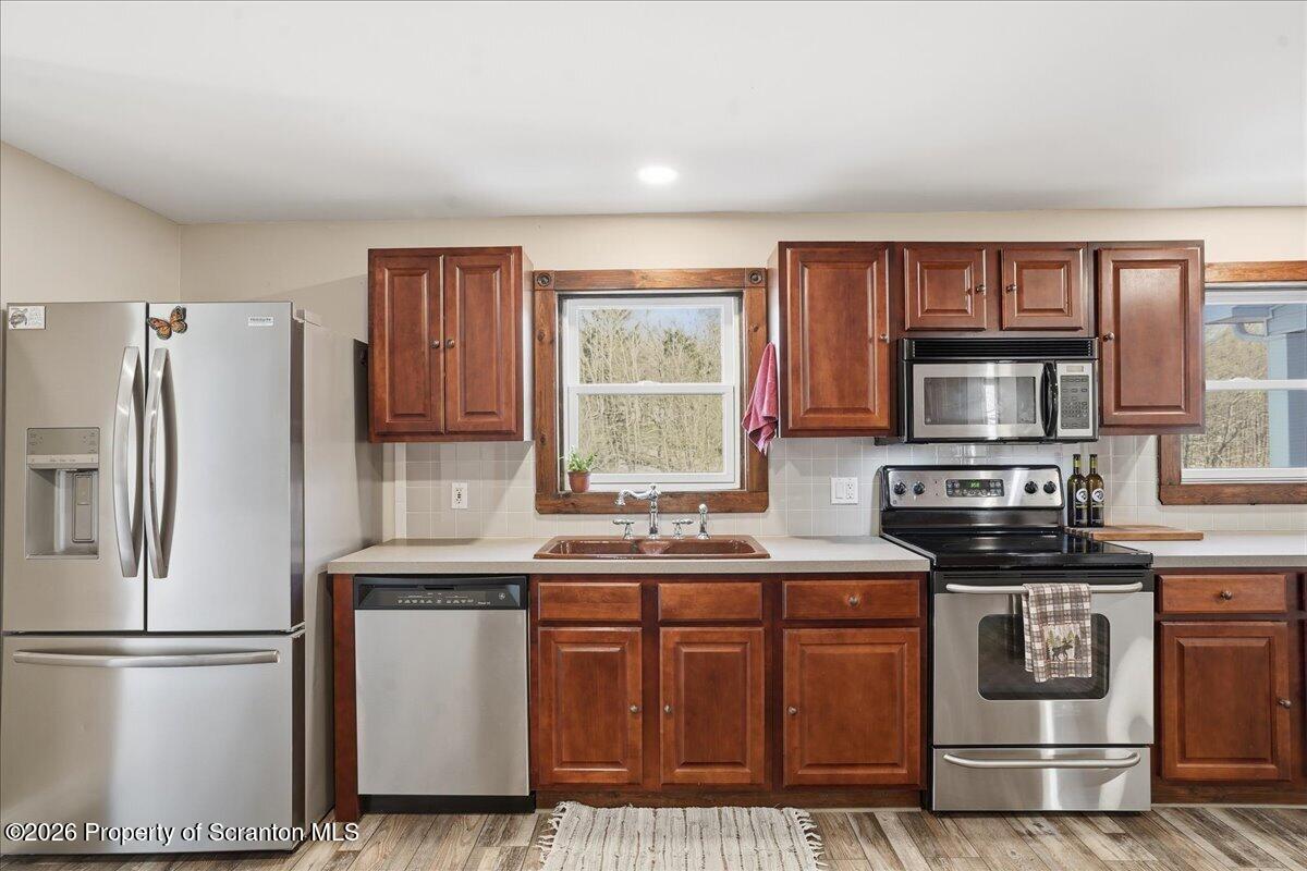 6105 State Rte 2012 Union Dale, PA 18470 - Photo 16 of 79 a kitchen with stainless steel appliances granite countertop a refrigerator sink and stove