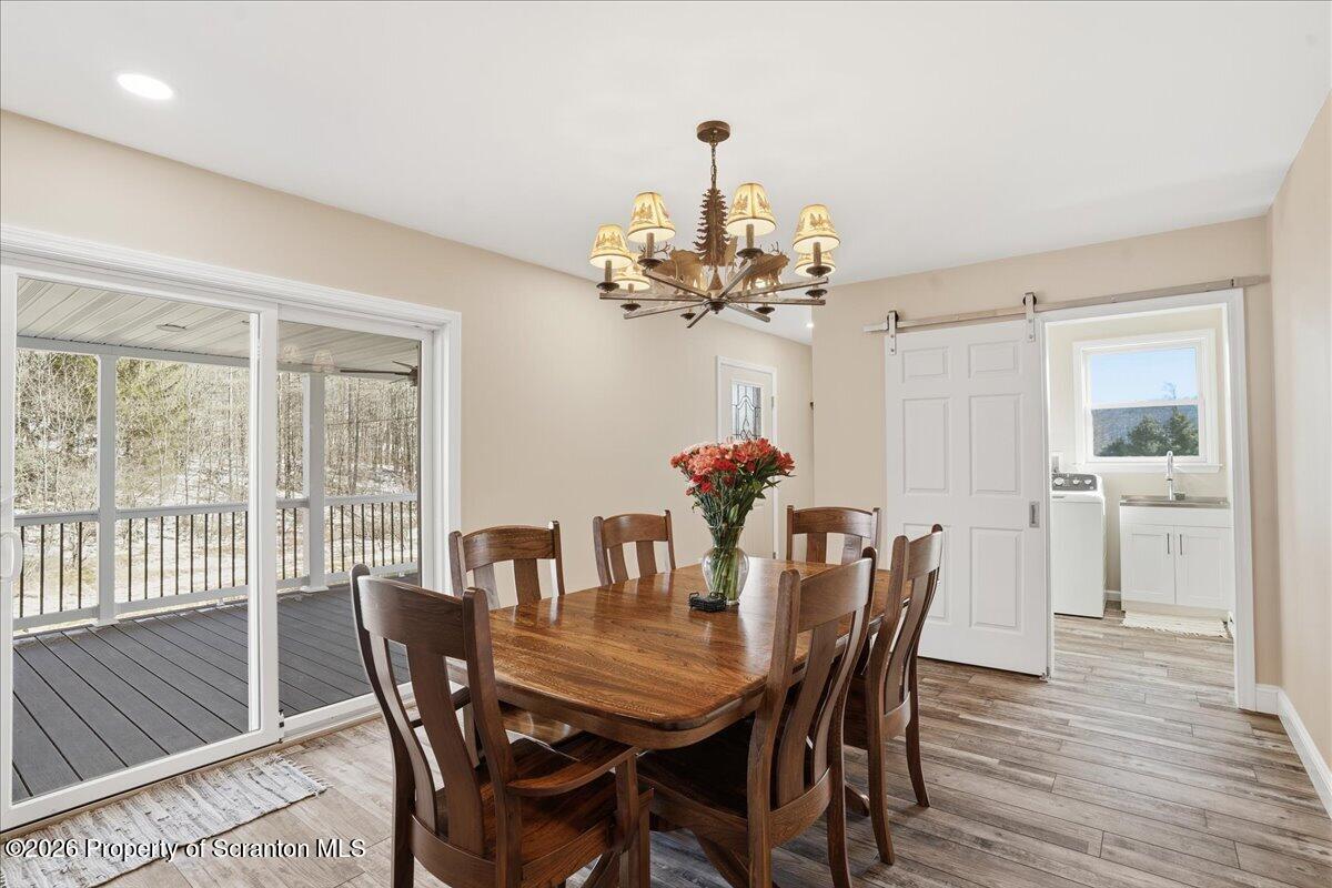 6105 State Rte 2012 Union Dale, PA 18470 - Photo 20 of 79 a view of a dining room with furniture window and wooden floor