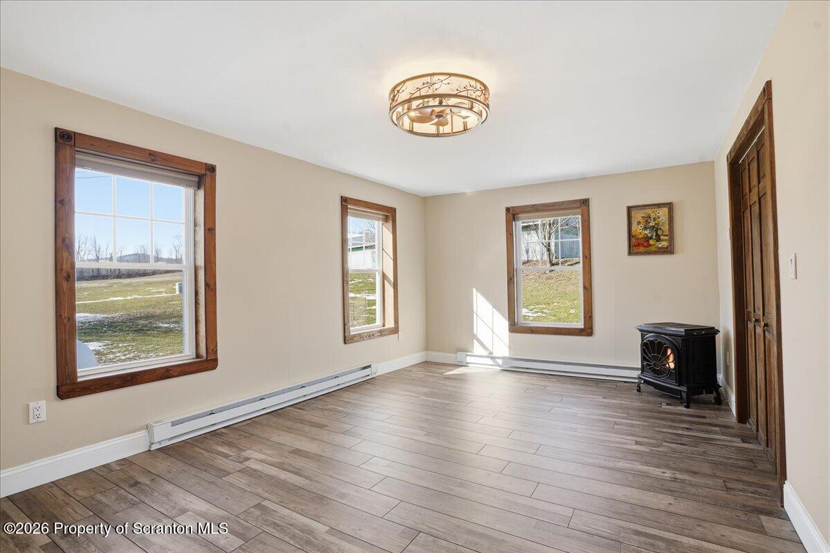 6105 State Rte 2012 Union Dale, PA 18470 - Photo 26 of 79 a view of an empty room with window and wooden floor
