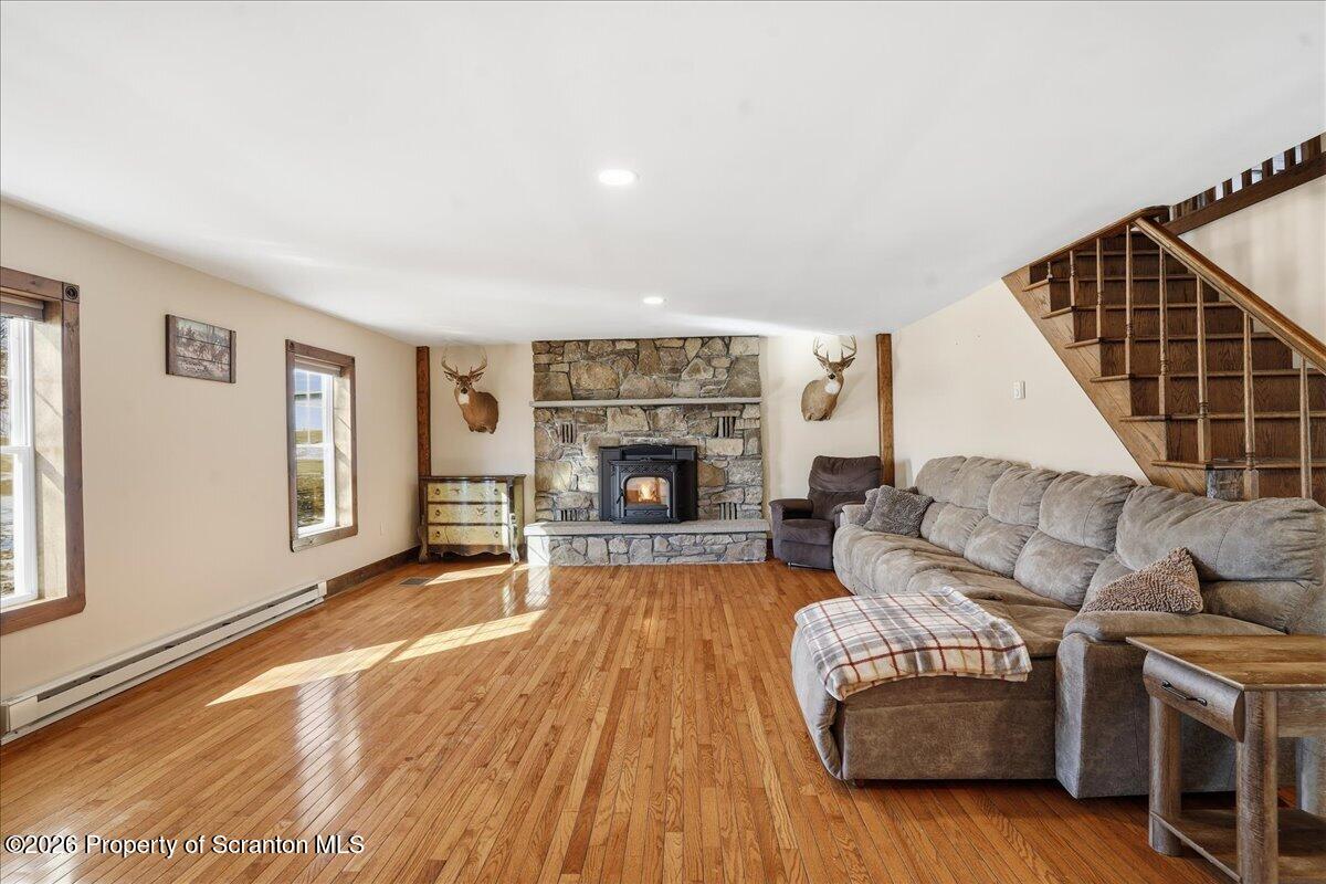 6105 State Rte 2012 Union Dale, PA 18470 - Photo 28 of 79 a living room with furniture and a fireplace