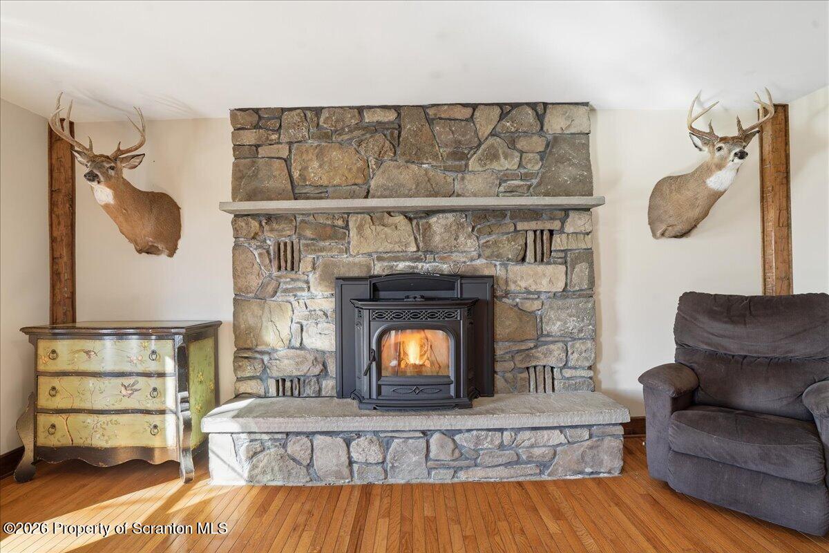 6105 State Rte 2012 Union Dale, PA 18470 - Photo 30 of 79 a living room with furniture and a fireplace