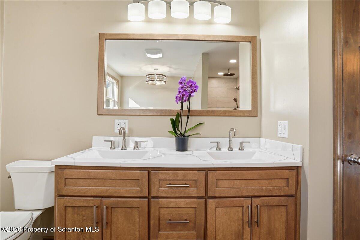 6105 State Rte 2012 Union Dale, PA 18470 - Photo 36 of 79 a bathroom with a sink vanity and a mirror