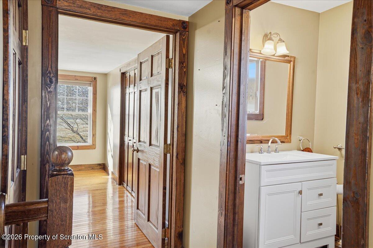 6105 State Rte 2012 Union Dale, PA 18470 - Photo 40 of 79 a bathroom with a sink a mirror and a shower