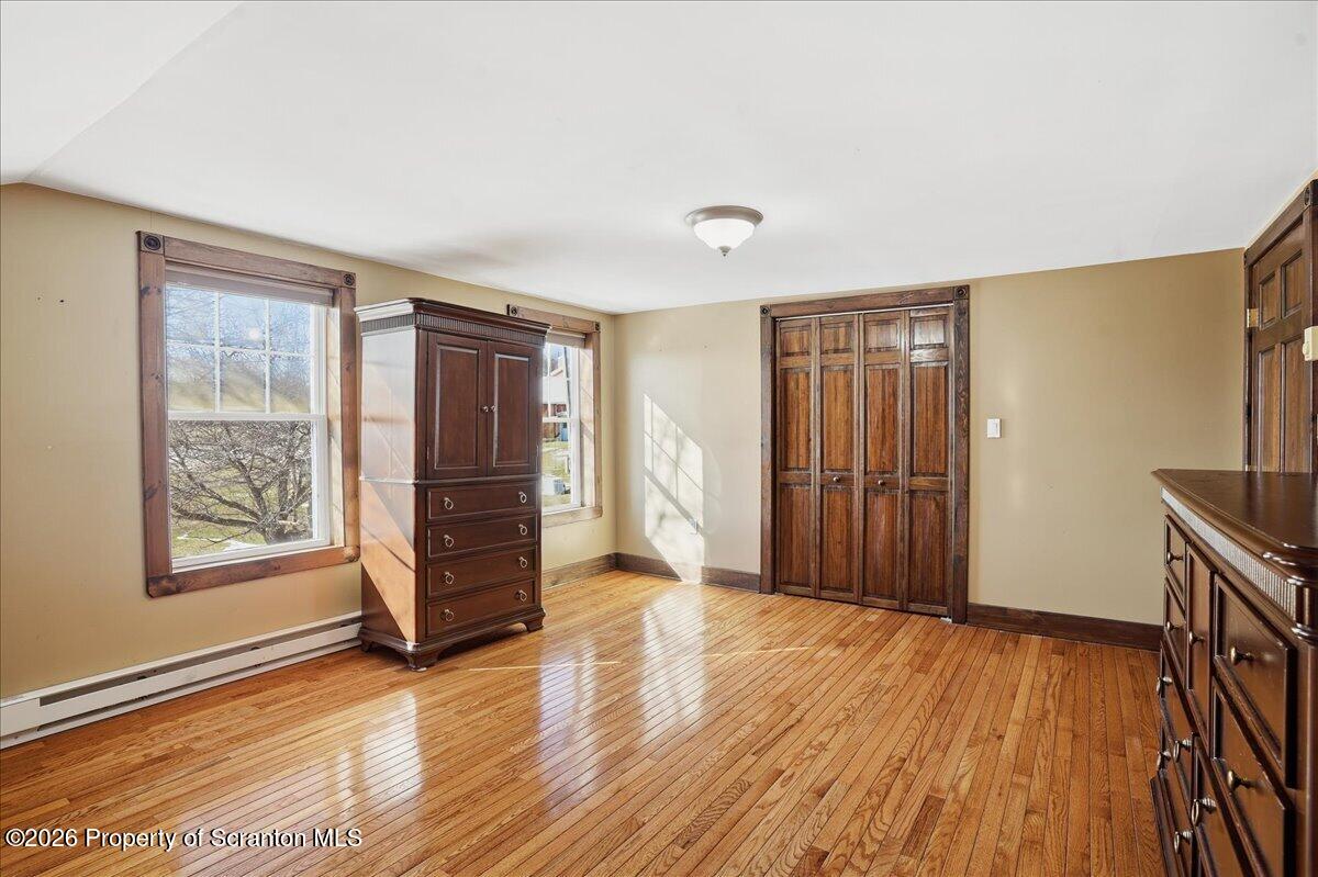6105 State Rte 2012 Union Dale, PA 18470 - Photo 43 of 79 an empty room with wooden floor and windows