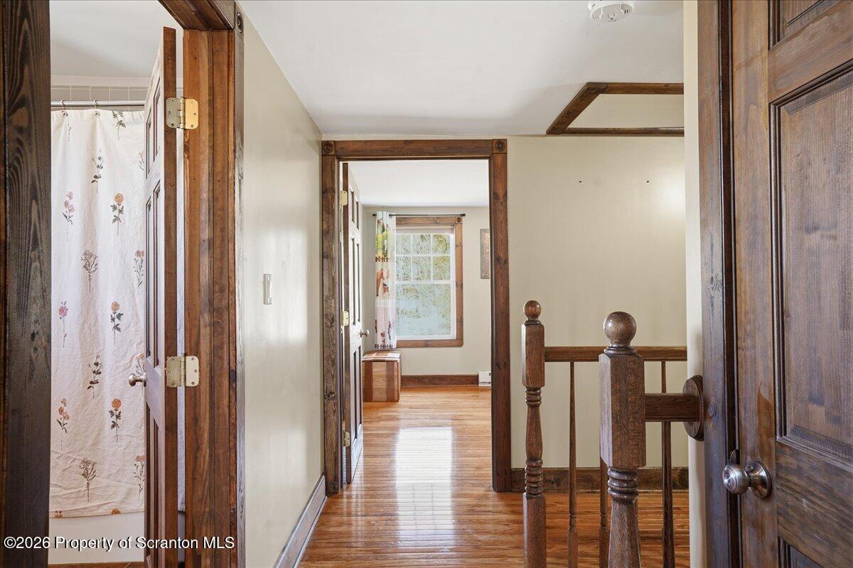 6105 State Rte 2012 Union Dale, PA 18470 - Photo 44 of 79 a view of a hallway with wooden floor and staircase