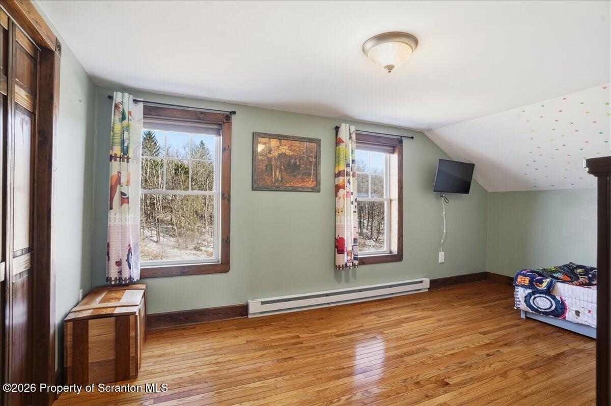6105 State Rte 2012 Union Dale, PA 18470 - Photo 45 of 79 a view of an empty room with window and wooden floor