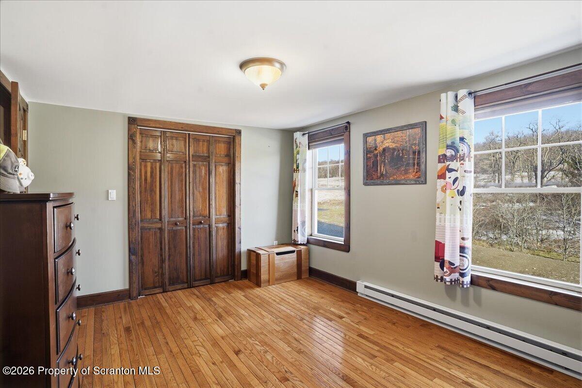 6105 State Rte 2012 Union Dale, PA 18470 - Photo 46 of 79 wooden floor in an empty room with a window