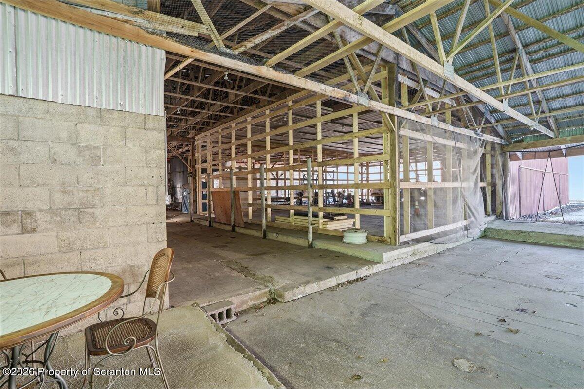 6105 State Rte 2012 Union Dale, PA 18470 - Photo 62 of 79 a view of a room with wooden floor and iron stairs