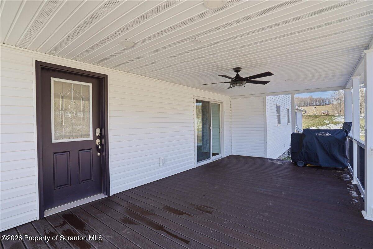 6105 State Rte 2012 Union Dale, PA 18470 - Photo 7 of 79 a view of empty room with wooden floor and ceiling fan