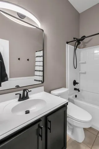 a view of a livingroom with furniture and a flat screen tv