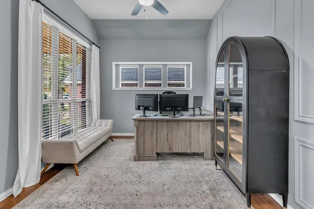 a kitchen with a refrigerator a stove a sink and a large window