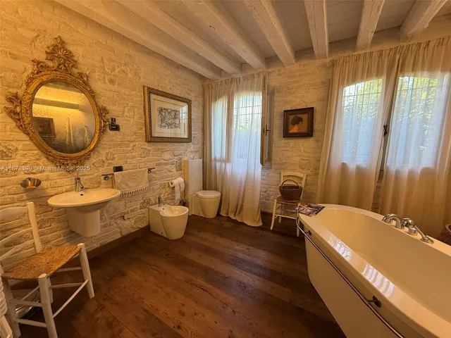 a bathroom with a tub and shower