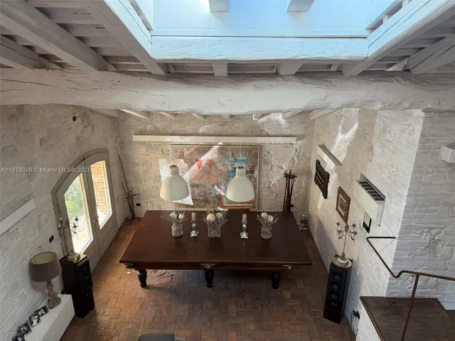 a view of two chairs in the balcony