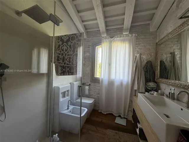 a very nice looking room with a large window and couch