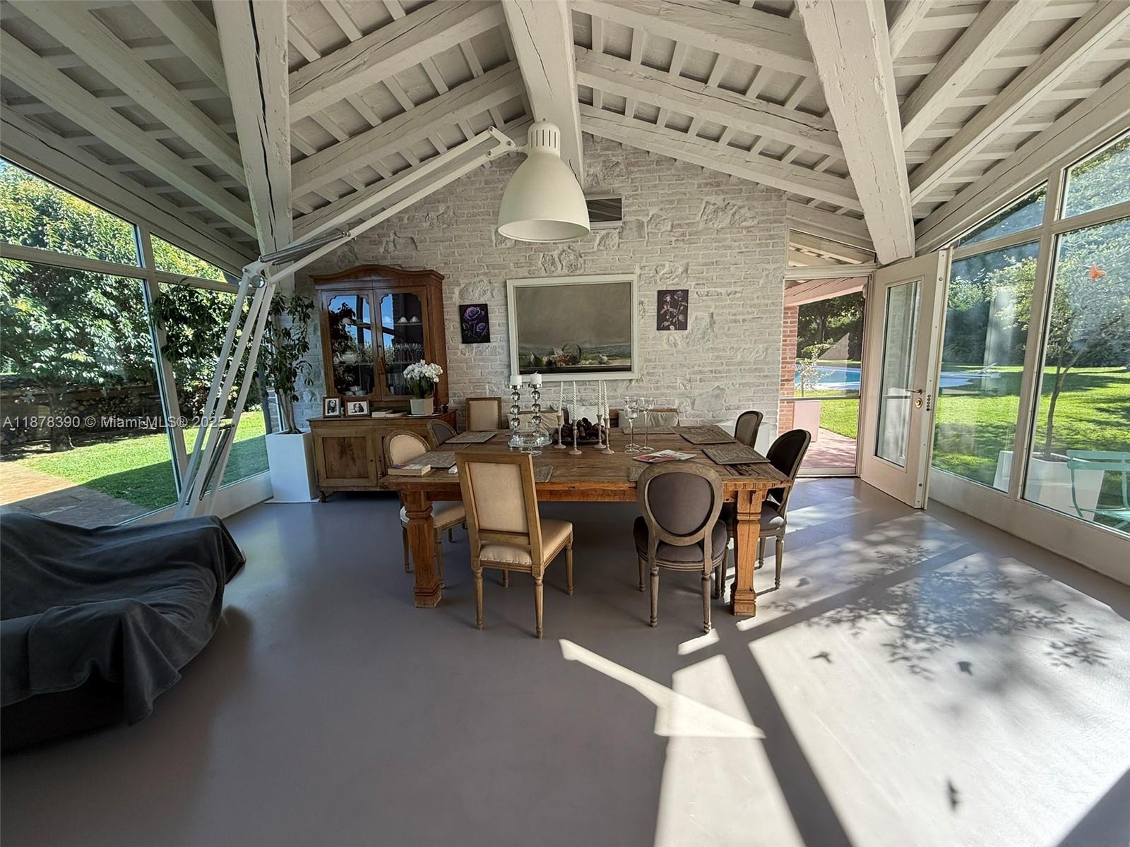 62 St Fosso (ve) Castellaro 62 Fosso (ve) Decatur, IT 30030 - Photo 10 of 39 a living room with furniture a flat screen tv and a floor to ceiling window