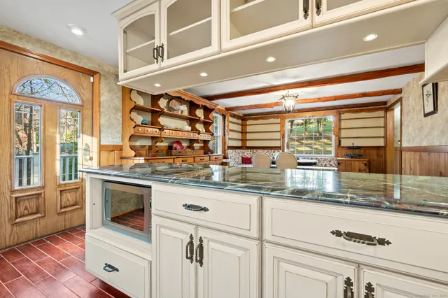 a kitchen with stainless steel appliances granite countertop a stove and a sink