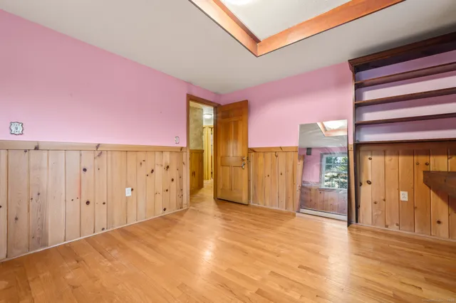 a view of a room with a hallway