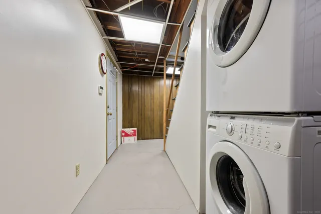 a view of storage and utility room with washer and dryer