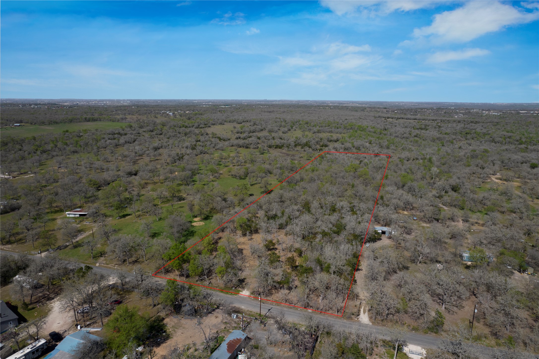 20600 Trappers Trail Manor, TX 78653 - Photo 1 of 7 Birds eye view of property featuring a forest view